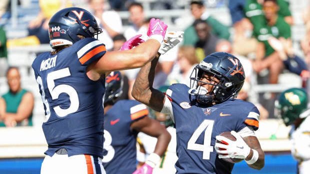 Malik Washington celebrates a touchdown during the Virginia football game against William & Mary at Scott Stadium.
